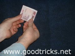 Roll the cigarette tightly in the note.