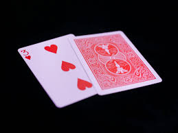 Hand of playing cards demonstrating the 2 card monte trick.