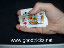 Grip the edge of the pack with your fingers and use your thumb to peel off the top card.