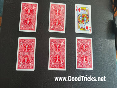 Display playing cards in two rows of three in preparation for a smooth performance of a card force.