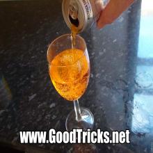 Pour soda into glass.