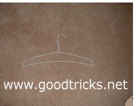 Squeeze the coat hanger to form a rod shape.