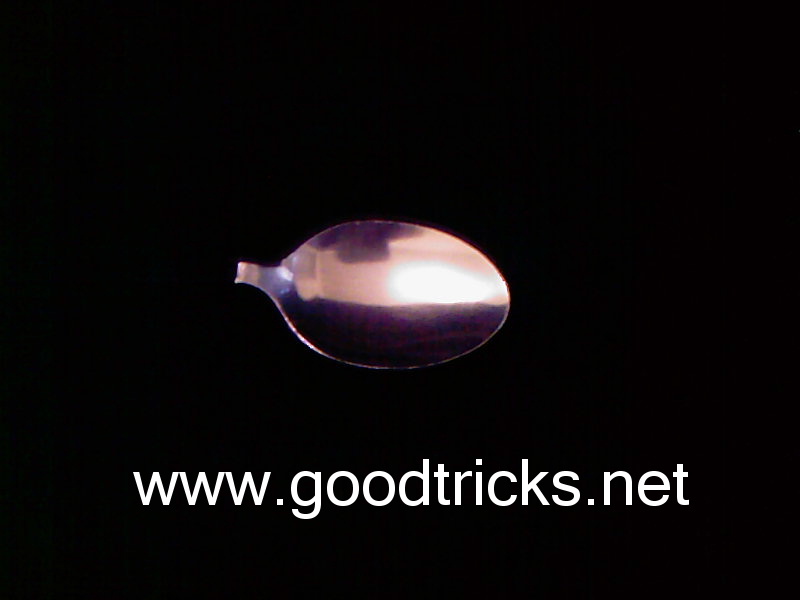 Prepare a teaspoon head from another teaspoon to use in your trick.