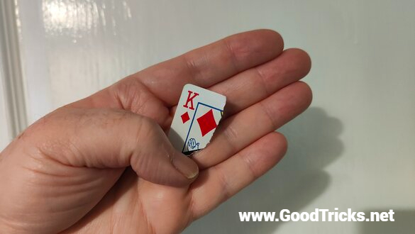 Torn off corner of a playing card hideen in the palm of your hand.